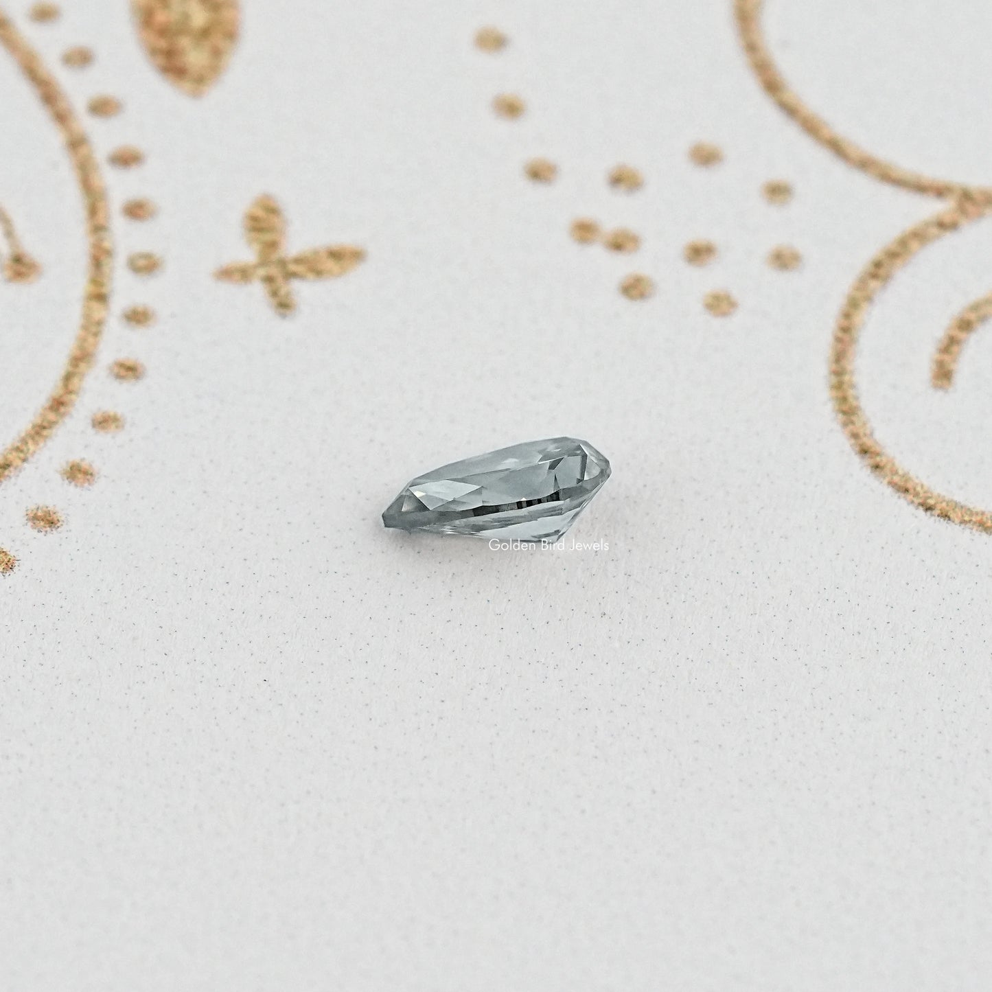 Side View of gray pear moissanite showing facets and shape