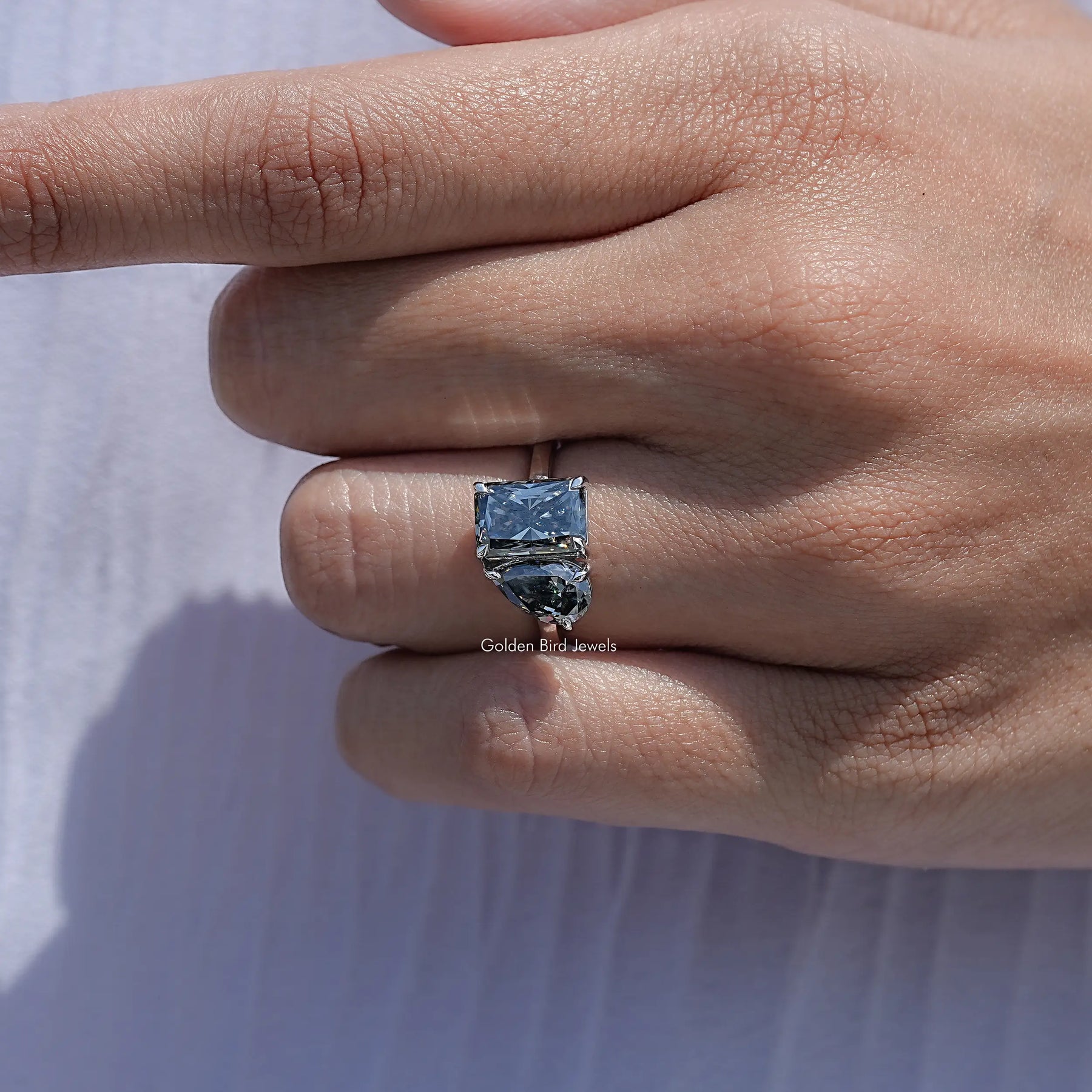 Close View Of Pear and Radiant Moissanite Ring
