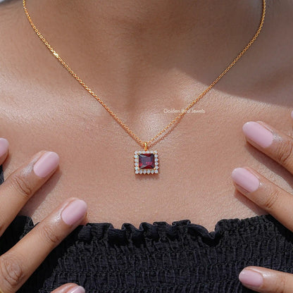 Gold chain necklace with square ruby-red pendant and sparkling halo setting