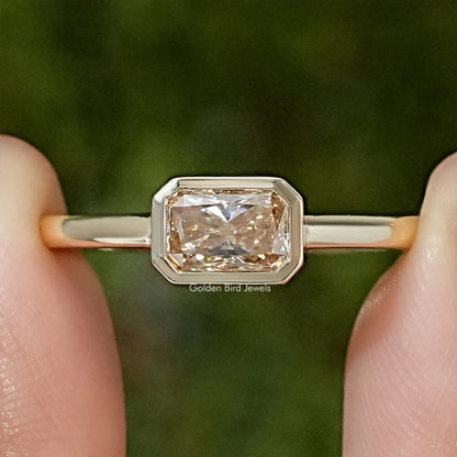 Gold-tone bezel-set radiant-cut moissanite solitaire engagement ring, slim band