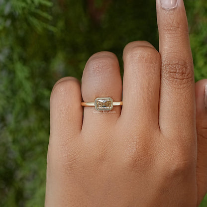 Gold-tone solitaire ring with square radiant-cut bezel moissanite, on hand