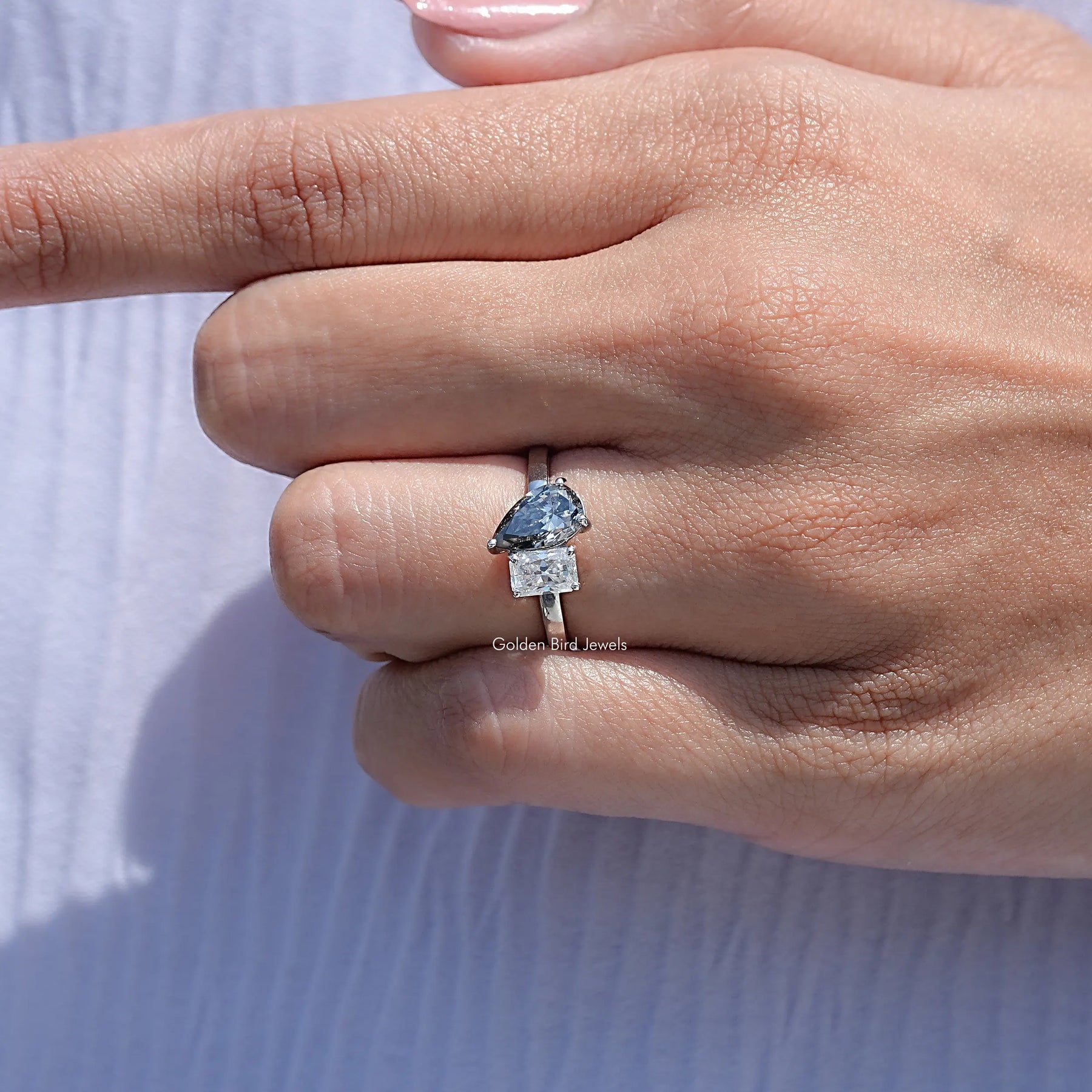 Close View Of Radiant And Pear Cut Moissanite Ring