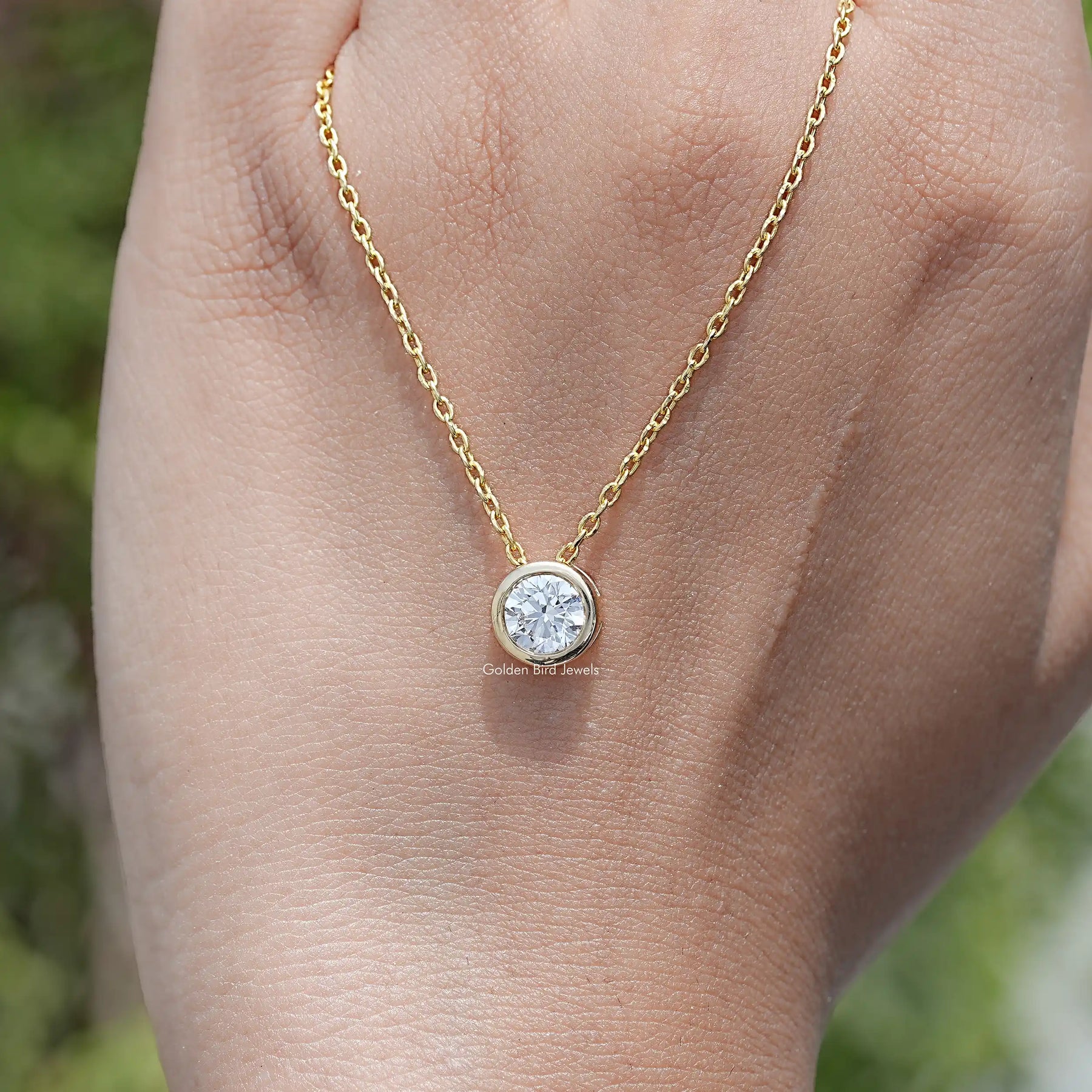 hand Showing View of Round Cut Lab Diamond Pendant