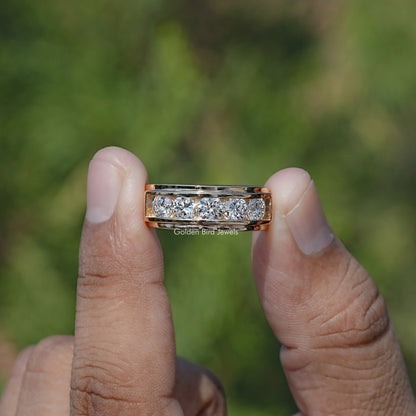 Front view of Lab Diamond Channel Set Men's Ring holding in two fingers 