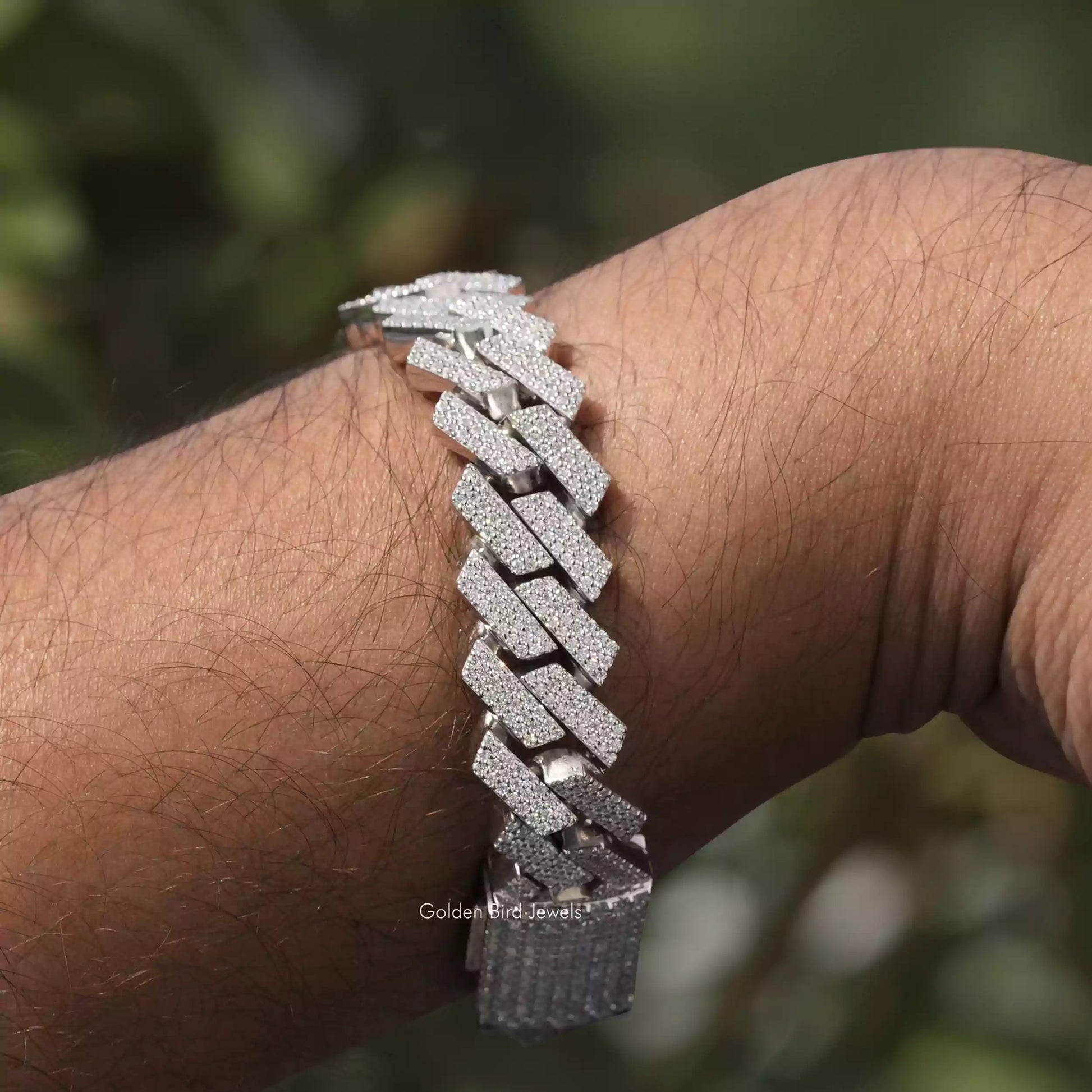 In hand showing view of moissanite bracelet