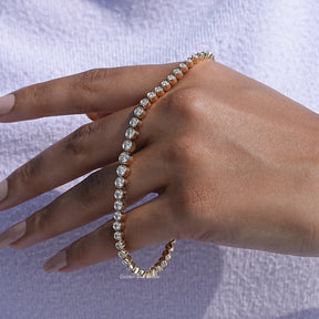 In hand showing view of moissanite round cut bracelet 