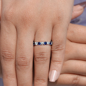 Detailed View Of Round Cut Blue Gemstone Eternity Band
