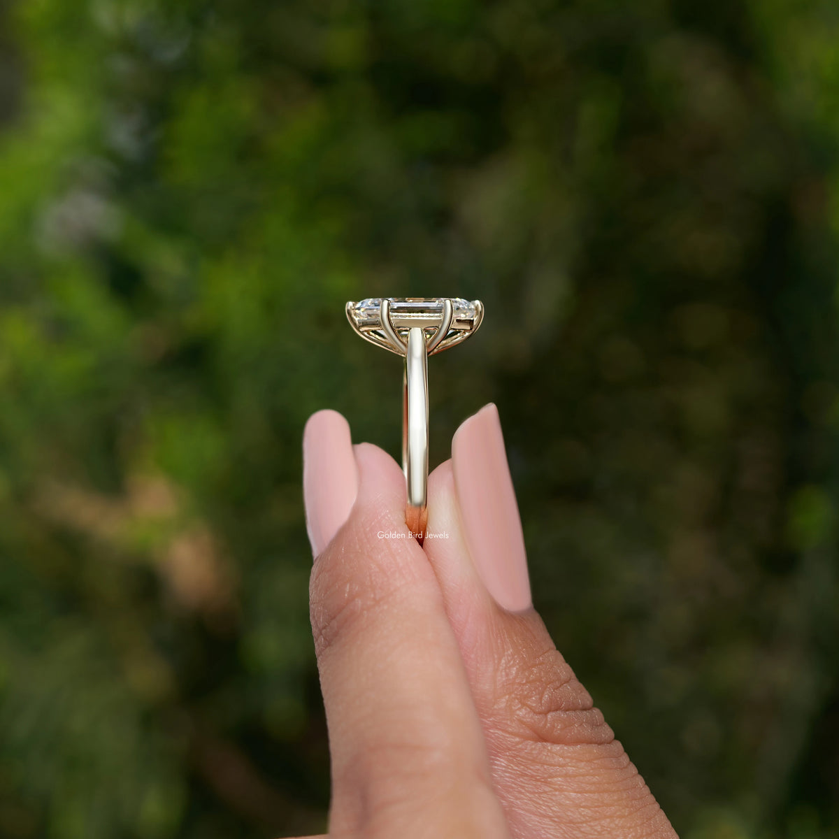 Side View of Step Cut Marquise Diamond Ring in two fingers