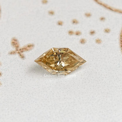 Faceted marquise golden moissanite gemstone, bright center facet and beveled edges