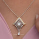 View of Portuguese cut moissanite solitaire pendant 